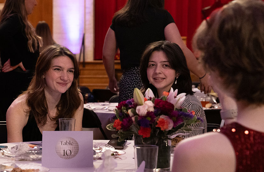 Photo of people sitting around a table with flowers in formal wear. Read about Beneficiary Designations