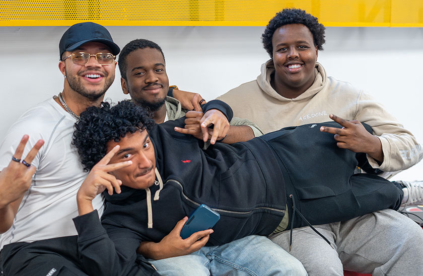Photo of students holding up another student and smiling. Read about Gifts by Estate Note Photo of students holding up another student and smiling. Read about Gifts by Estate Note