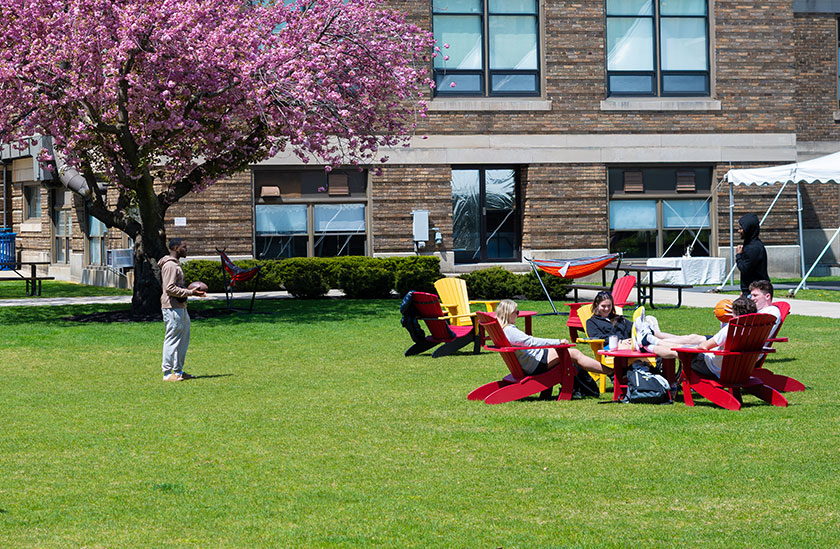 Photo of students enjoying the nice weather outside. Links to Gifts of Cash, Checks, and Credit Cards
