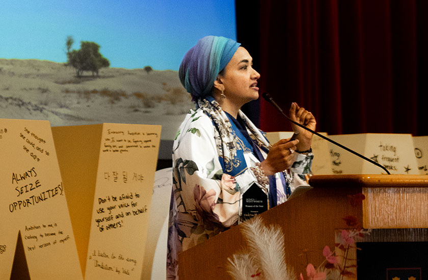 Photo of a woman giving a speech. Links to Closely Held Business Stock