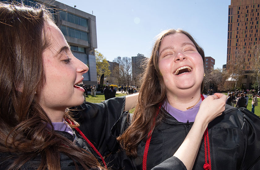 Photo of two students in cap and gown laughing. Read about Gifts by Will Photo of two students in cap and gown laughing. Read about Gifts by Will