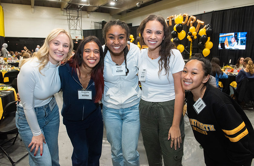 Photo of a group of students smiling. Links to Gifts of Life Insurance